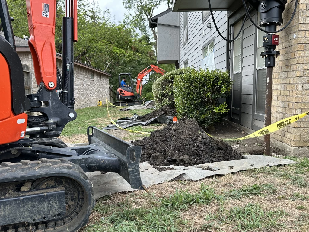 IMG4-photo-of-level-home-foundation-repair-teams-performing-repairs-outside-a-home