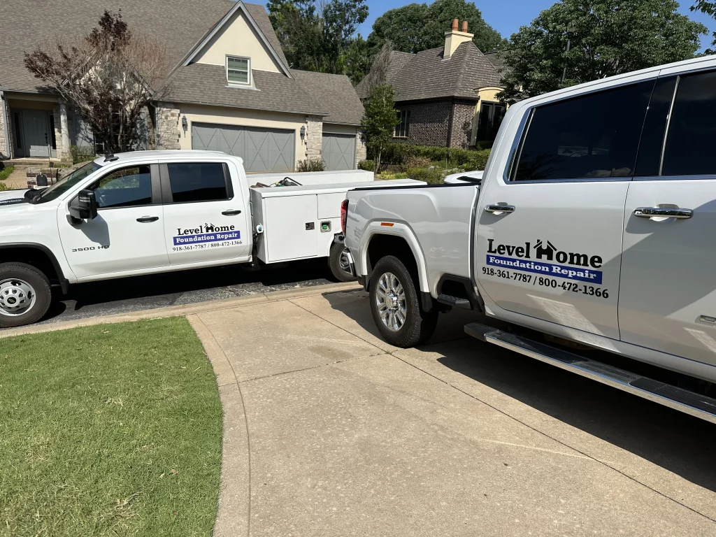 photo-of-level-home-foundation-repair-trucks-at-a-tulsa-home