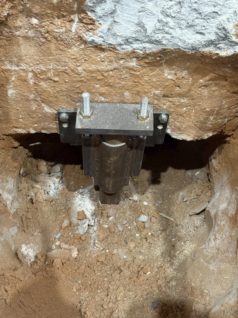 photo of foundation repair using steel piers