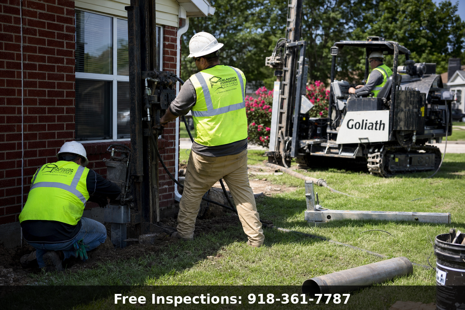 Foundation repair crew installing steel piers on a Tulsa Oklahoma home