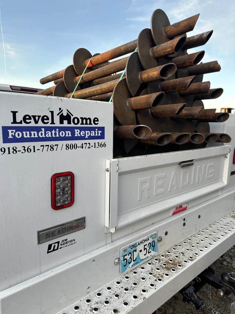 Pier installation for foundation stabilization in Tulsa