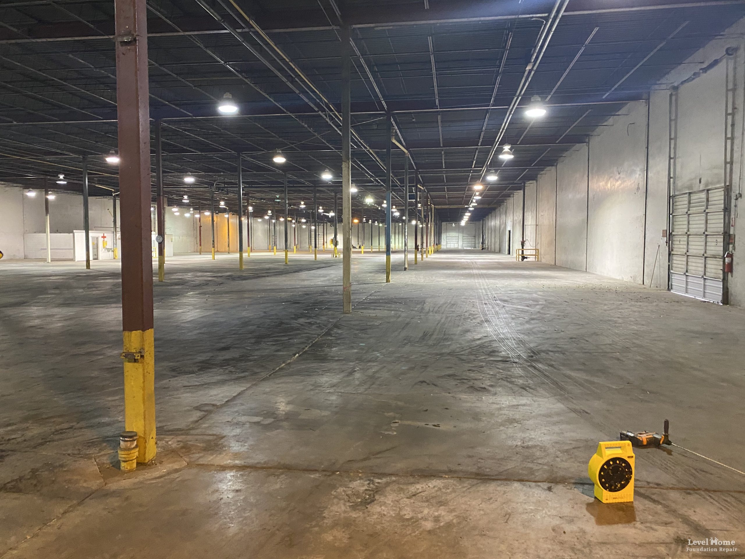 Level Structural team conducting a structural assessment of a large industrial warehouse floor in Oklahoma
